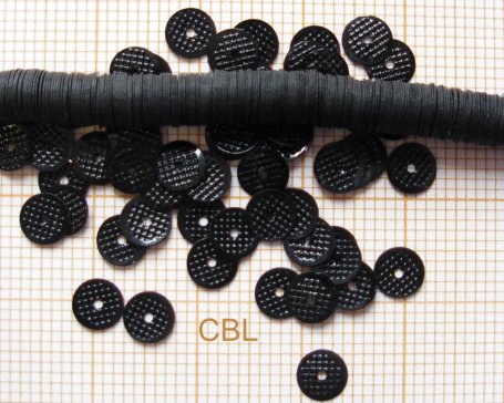 Paillettes texturées sur fil PA 00/15